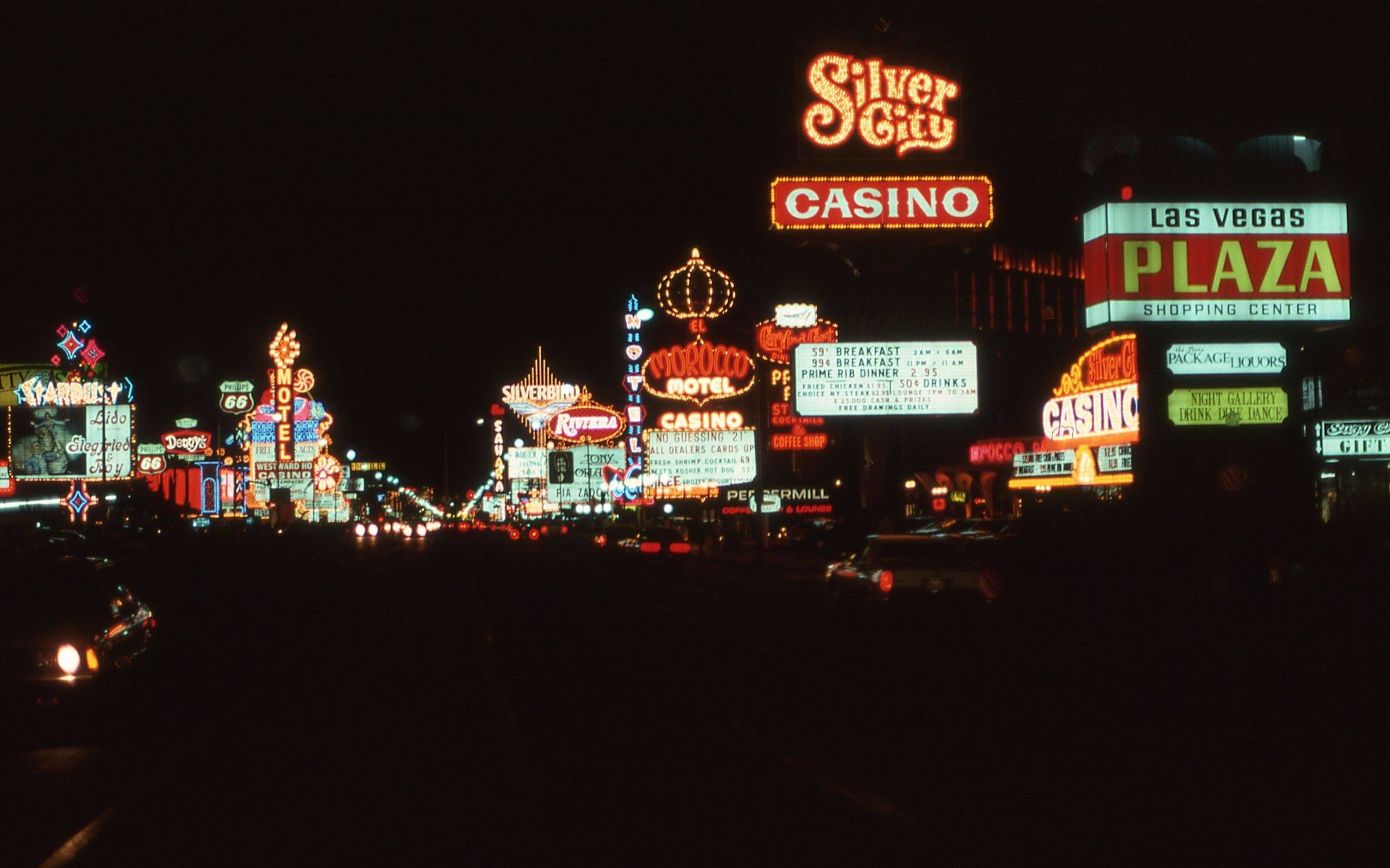 Vintage neon casino signs glowing at night in downtown Las Vegas